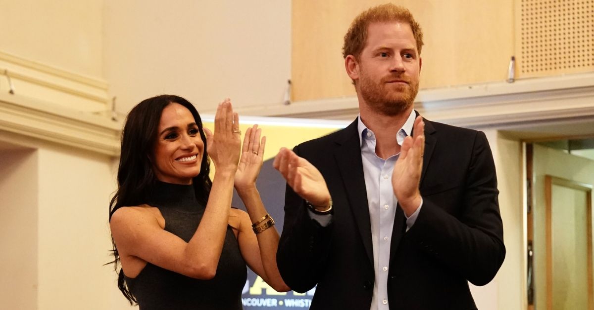 Prince Harry and Meghan Markle clap hands