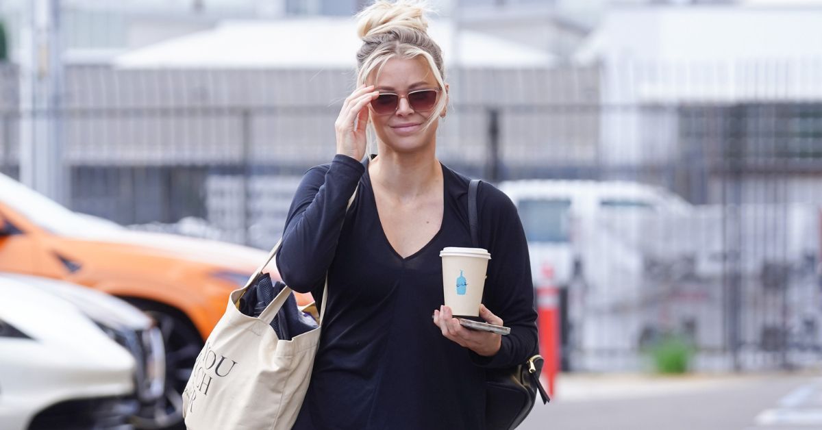 Ariana Madix walking outside with coffee to rehearsal 