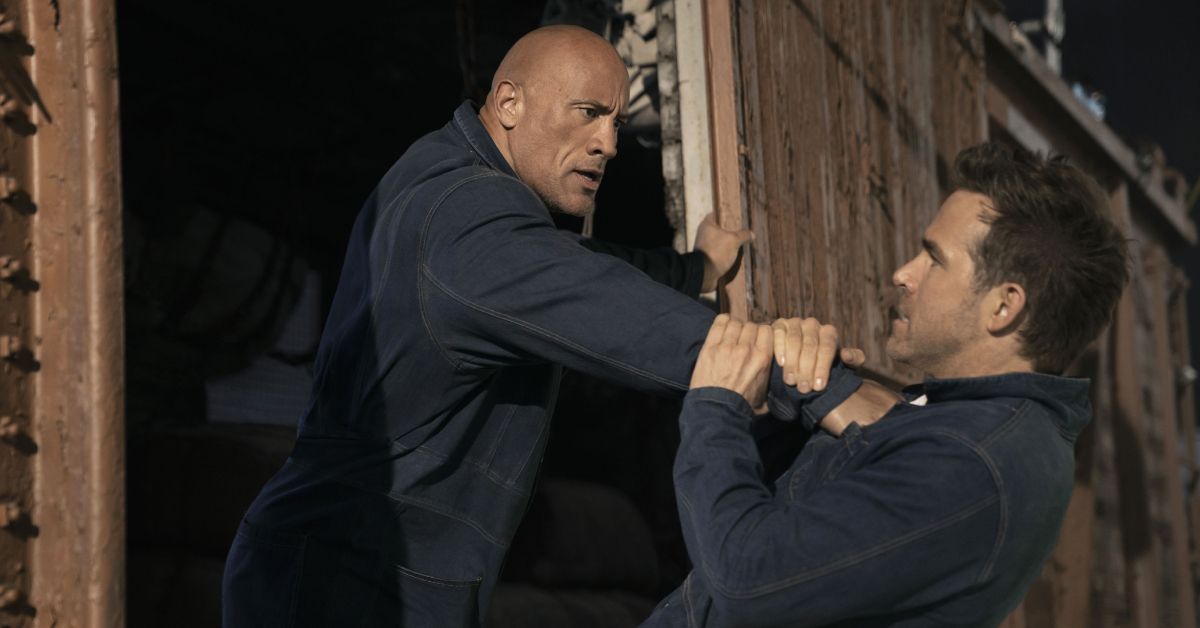 Dwayne Johnson and Ryan Reynolds fighting from Red Notice