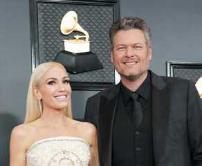 Gwen Stefani and Blake Shelton pose for photos