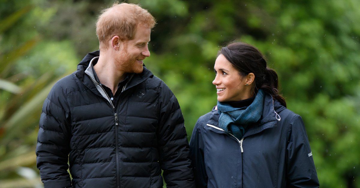 Prince Harry and Meghan Markle smile at each other
