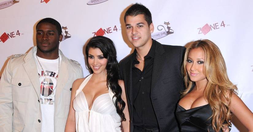Reggie Bush, Kim Kardashian, Rob Kardashian, and Adrienne Bailon smiling