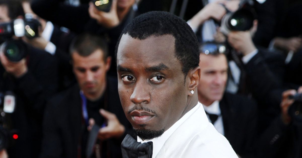 Diddy wearing a white suit on the red carpet