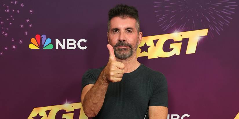 Simon Cowell giving the thumbs up on the red carpet