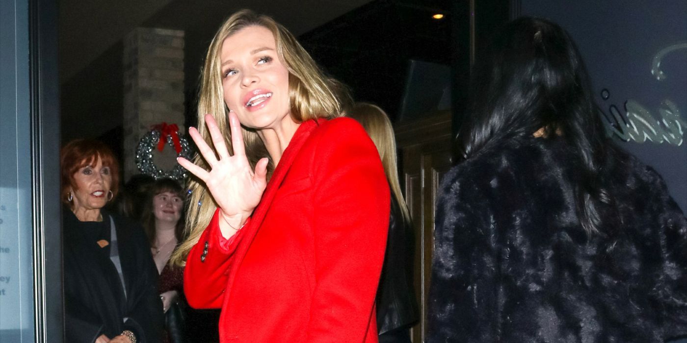 Joanna Krupa from RHOM waving to cameras