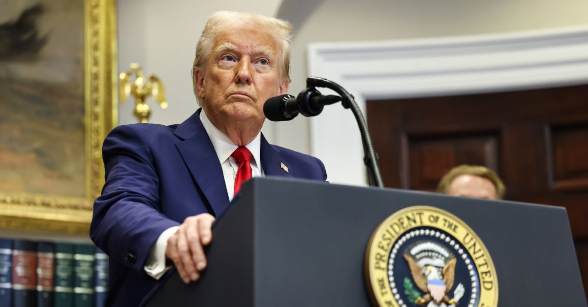 Donald Trump behind the seal of The President of the United States