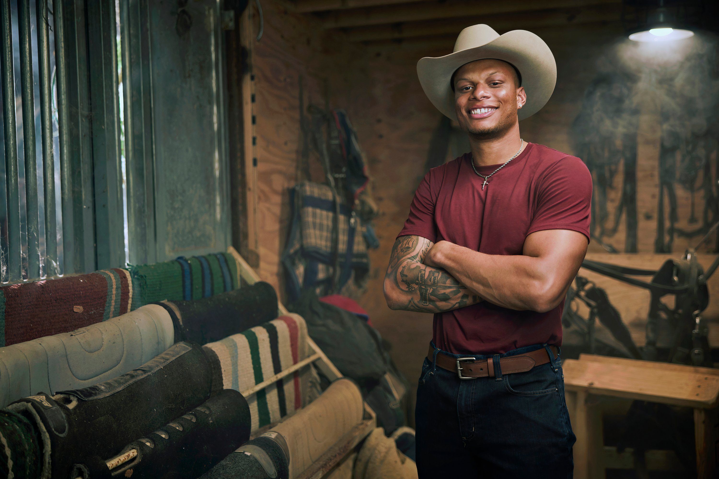 man in a red shirt and white cowboy hat