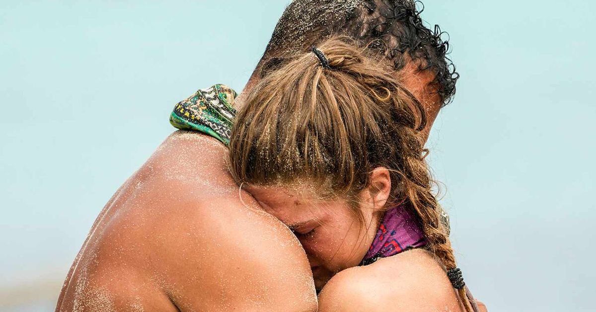 Survivor's Eva Erickson and Joe Hunter embracing while he helps her