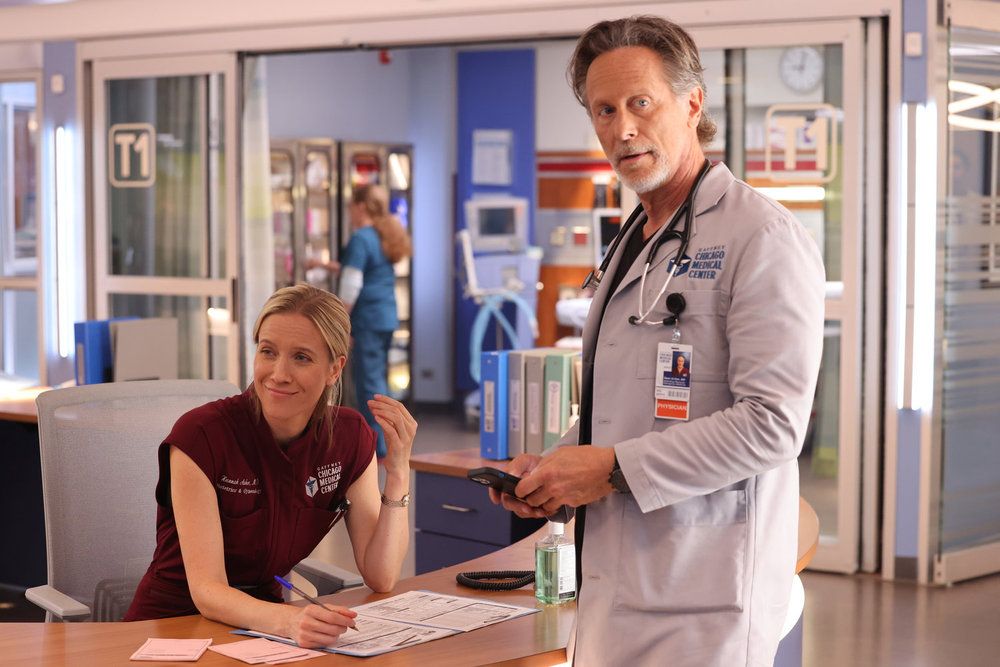 Chicago Med's Jessy Schram as Dr. Hannah Asher and Steven Weber as Dr. Dean Archer