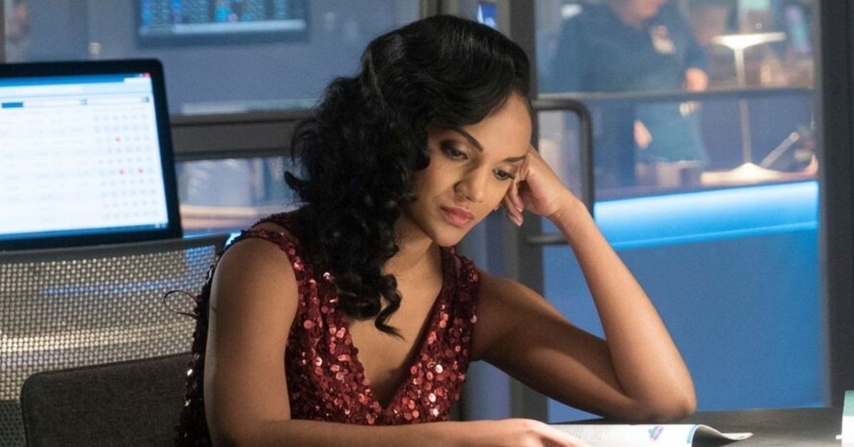 Chicago Med's Mekia Cox looking upset while reading