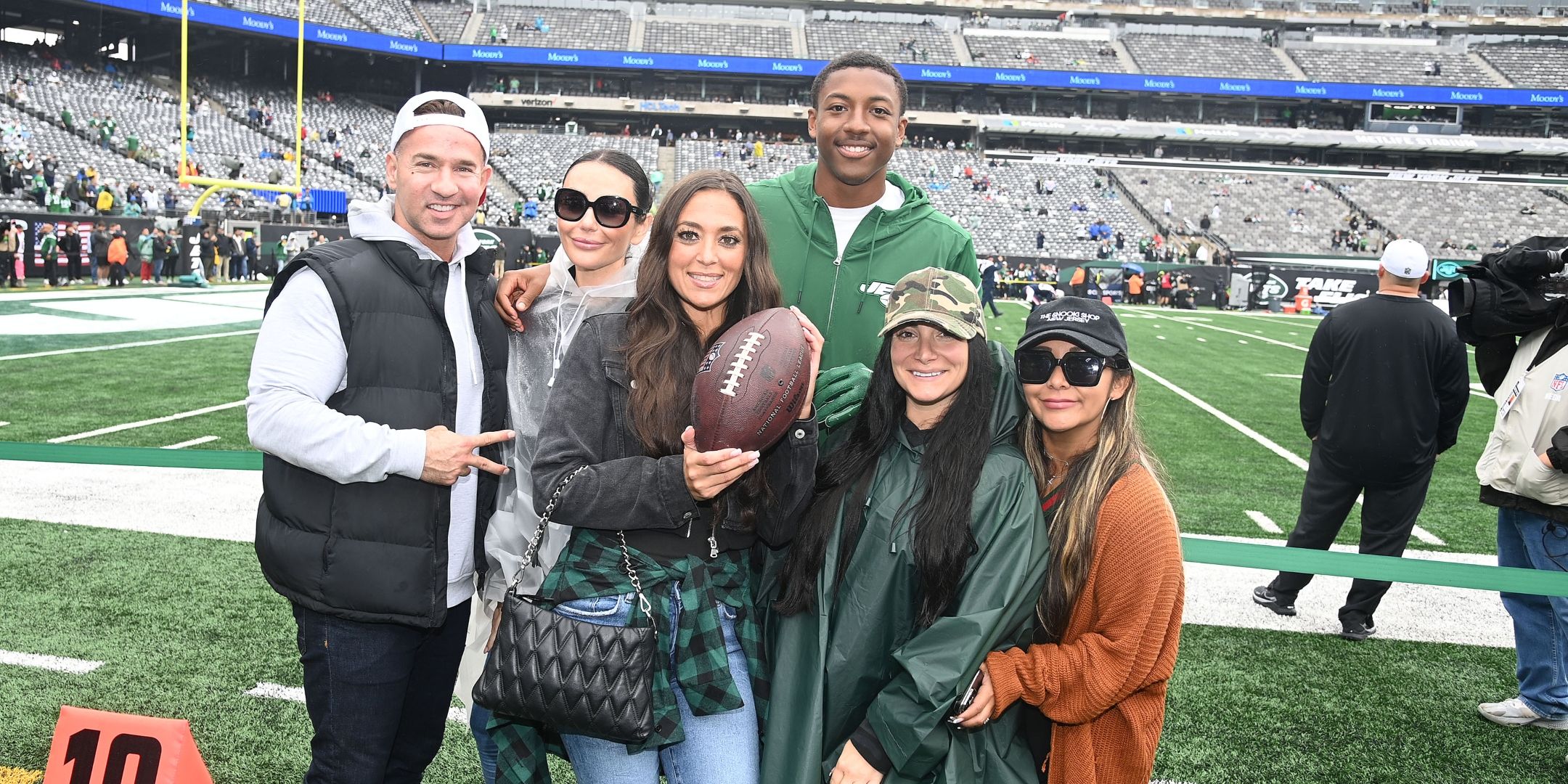 Jersey Shore cast smiling at The New York Jets Game