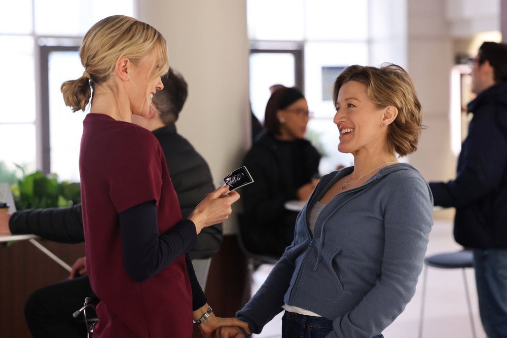 Chicago Med's Jessy Schram as Dr. Hannah Asher and Erin Anderson as Elizabeth Lizzy Asher laughing
