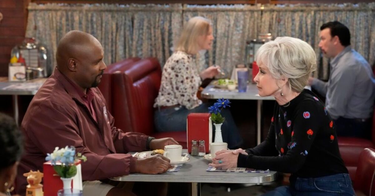 Georgie & Mandy's First Marriage's Annie Potts and Doc Farrow sitting at a table facing each other