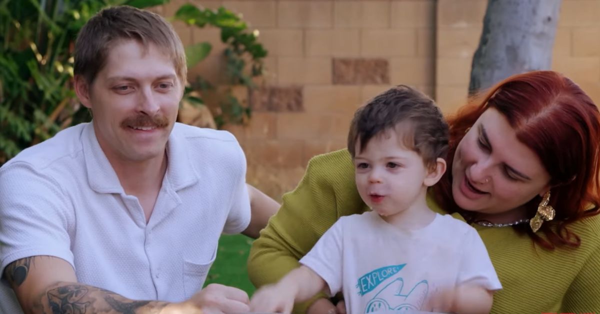 Anthony and Manon playing with their son
