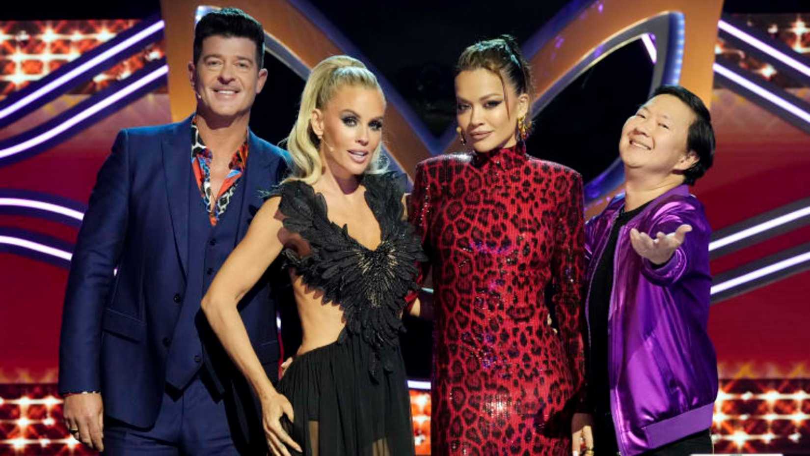 The Masked Singer Panelists Robin Thicke, Jenny McCarthy-Wahlberg, Rita Ora, and Ken Jeong Posing Together