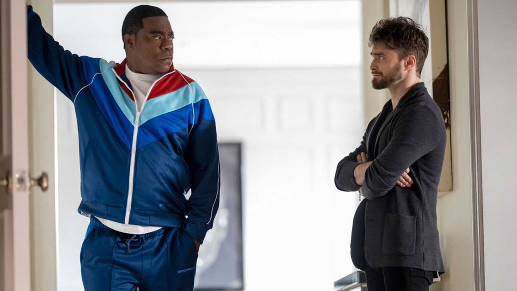 The Fall and Rise of Reggie Dinkins' Tracy Morgan and Daniel Radcliffe Looking At Each Other Annoyed