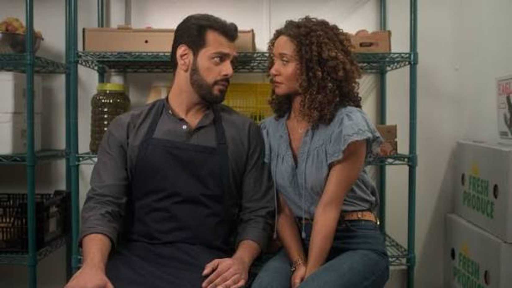 Sullivan's Crossing's Amir (Fuad Ahmed) and Sydney (Lindura) Looking Into Each Other's Eyes